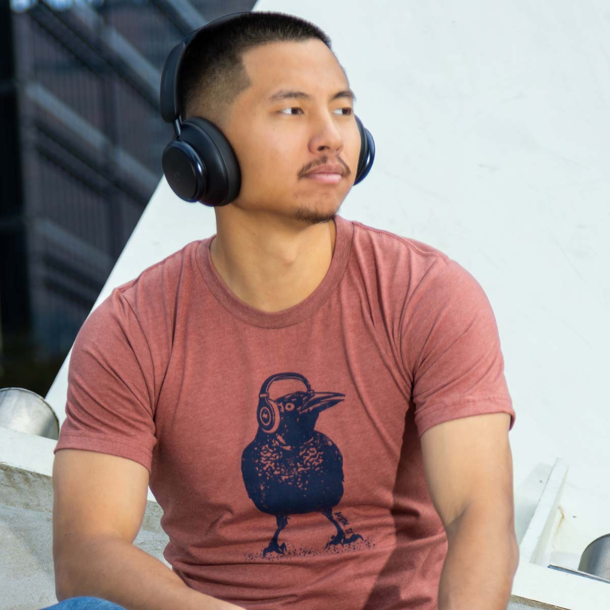 Austin Beats Grackle shirt with headphones-wearing bird