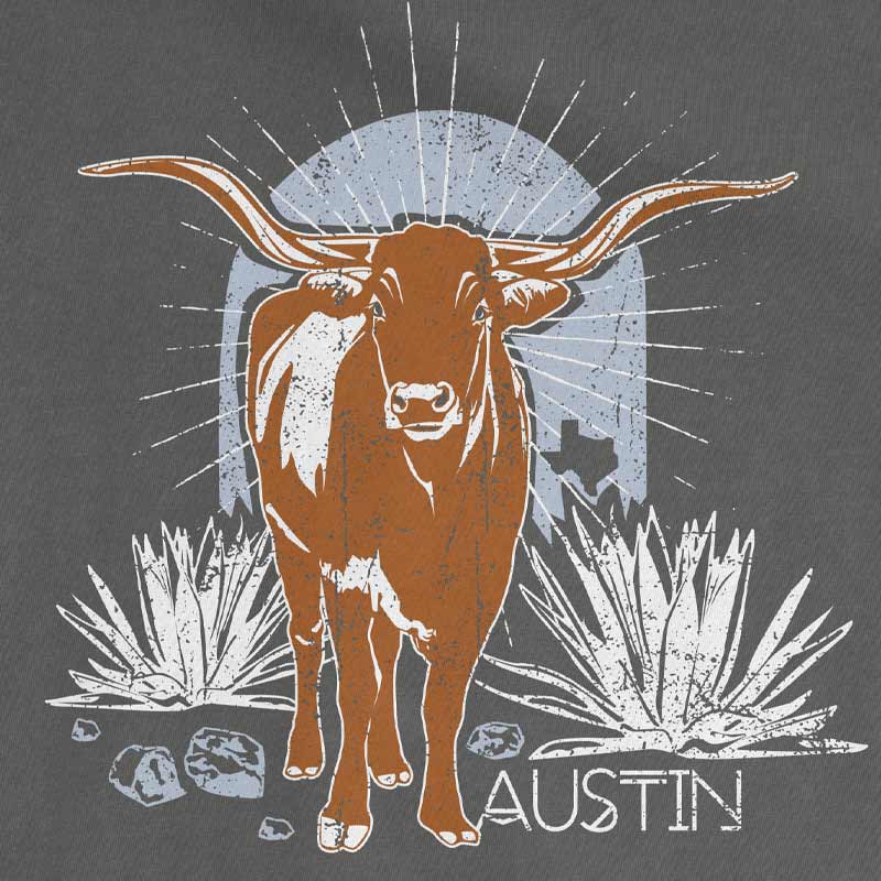 Close-up of longhorn steer and ATX text printed on garment-dyed cotton fabric