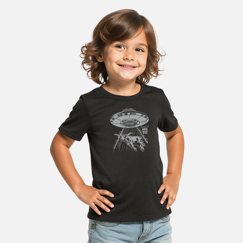 Child wearing a black t-shirt with a graphic design on a white background