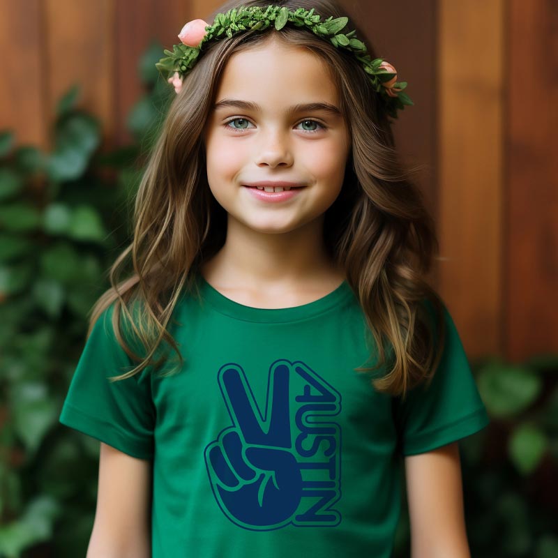 Model wearing our Groovy Austin youth t-shirt with retro-inspired graphic – colorful and fun ATX tee for kids