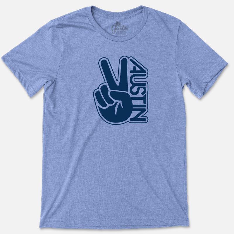 T-shirt with retro wavy “Austin” text and peace sign graphic in vibrant colors
