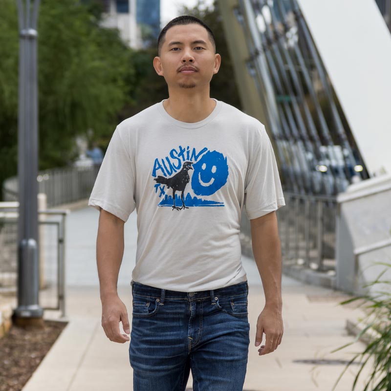 Happy Grackle ATX t-shirt with bold graphic of grackle mid-strut – fun Austin-themed design