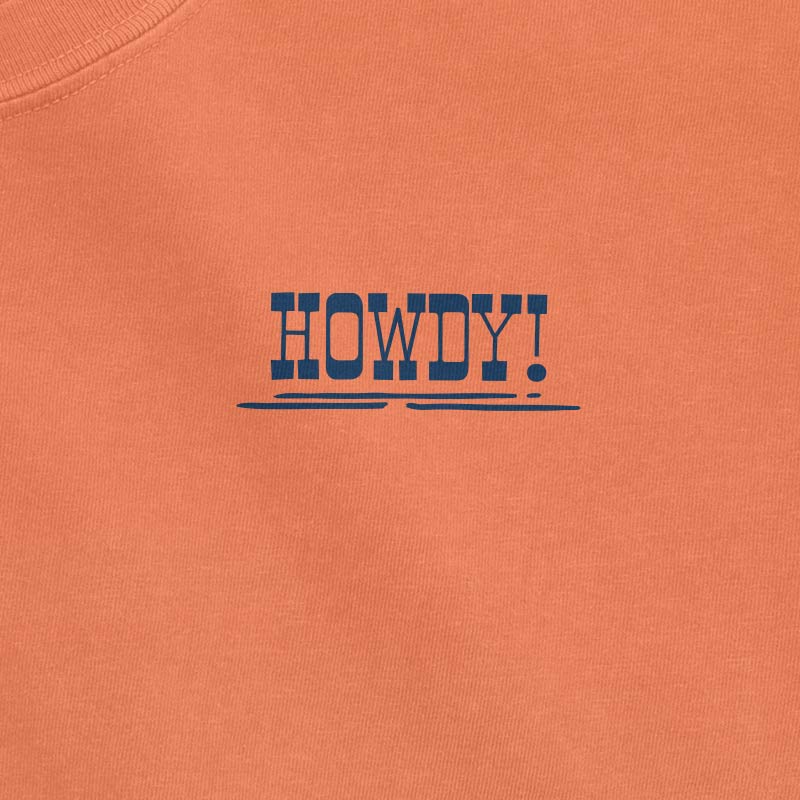 Orange tee with 'HOWDY!' text in blue on a plain background