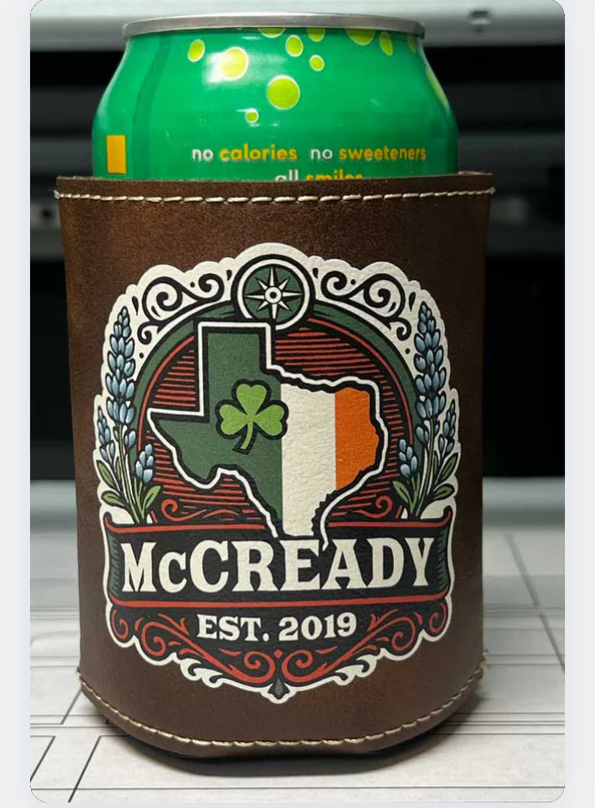Can cooler with 'McCready' design on a blurred background