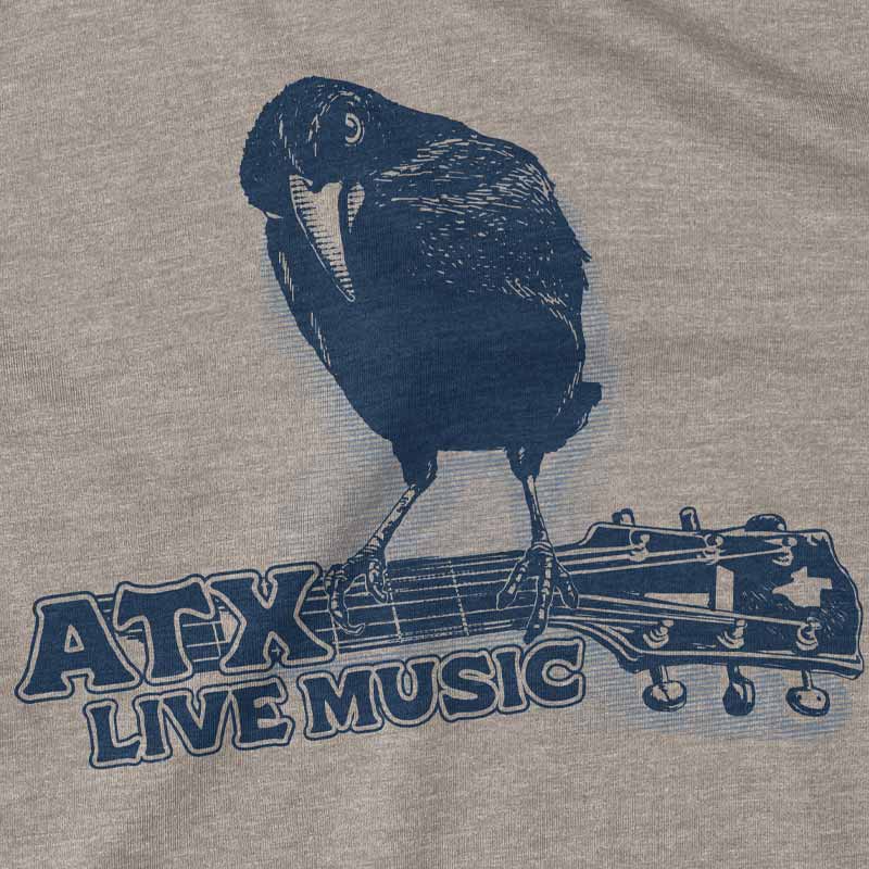 Close-up of crow sitting on guitar with ATX lettering, printed on soft cotton fabric