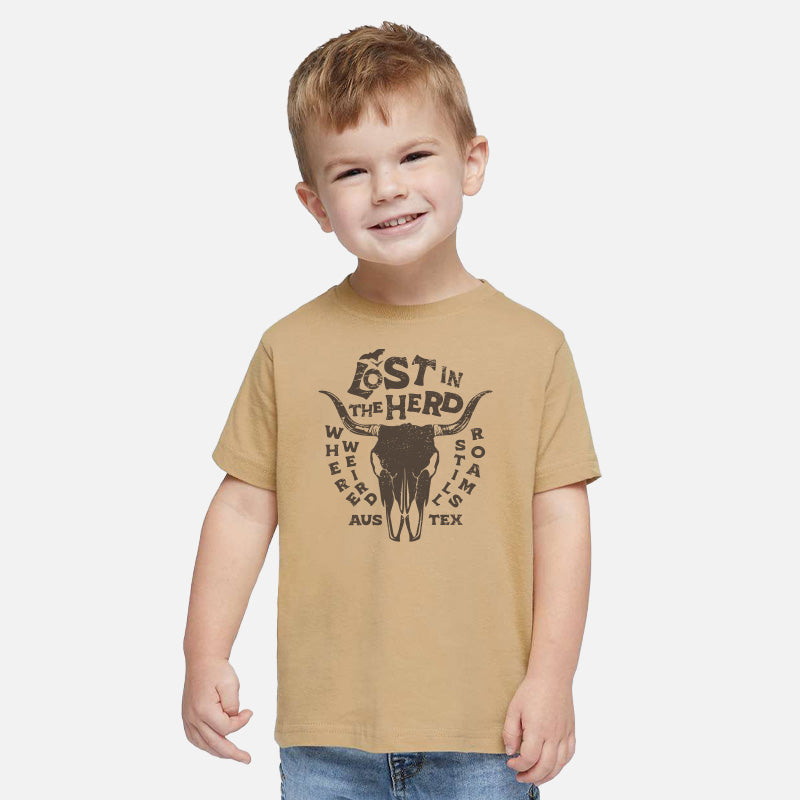 Child wearing a tan t-shirt with a graphic design on a white background