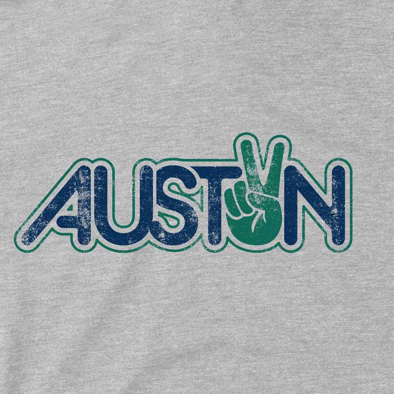 Close-up of peace sign and Austin lettering printed on minimalist graphic tee