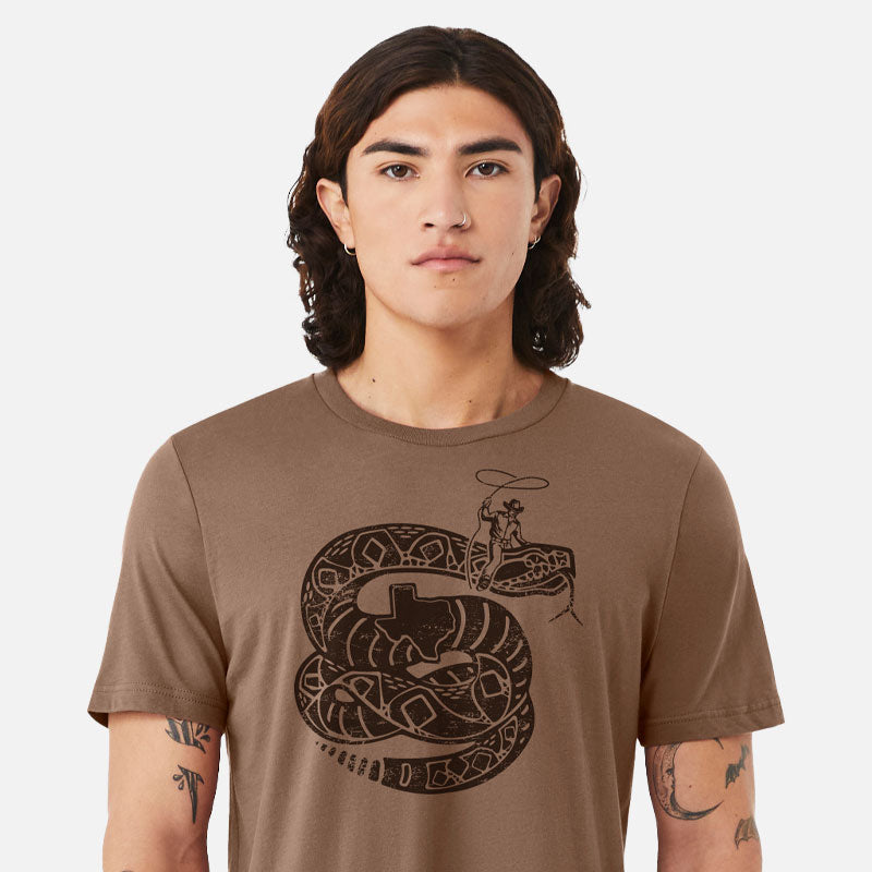 Model wearing Rattler Wrangler t-shirt – soft cotton tee with bold rattlesnake graphic and Western-inspired design