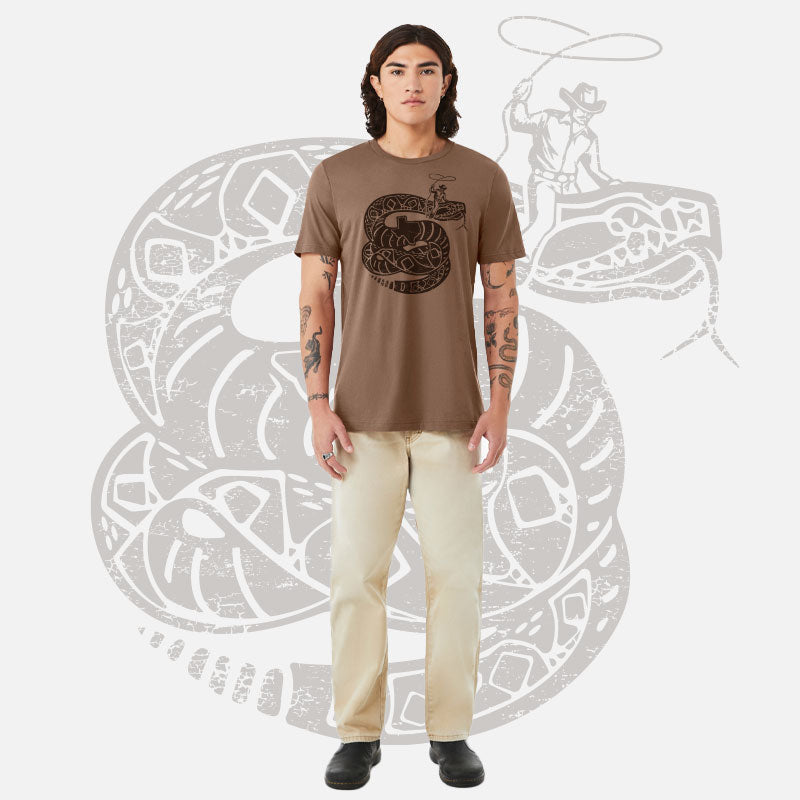 Model wearing Rattler Wrangler t-shirt – soft cotton tee with bold rattlesnake graphic and Western-inspired design