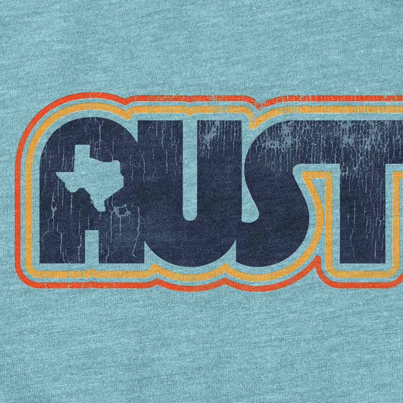 Close-up of colorful retro Austin text graphic on t-shirt