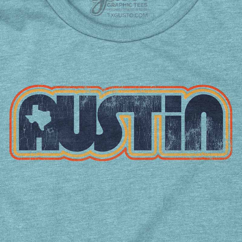 Close-up of colorful retro Austin text graphic on t-shirt
