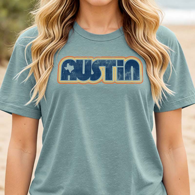 Model wearing Retro Austin t-shirt with vintage design, standing outdoors