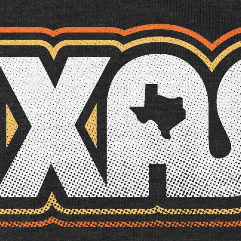 Close-up of Retro Texas T-shirt graphic worn by model, showing texture and detail