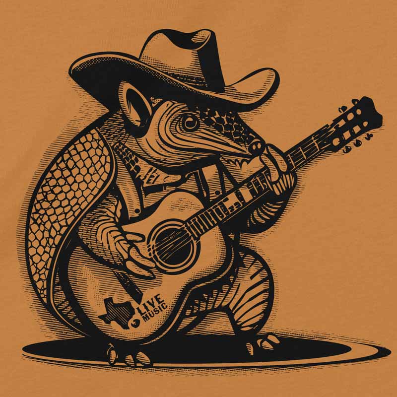 Close up of our Rockin’ Armadillo youth t-shirt with cartoon armadillo playing guitar – fun Texas music tee for kids