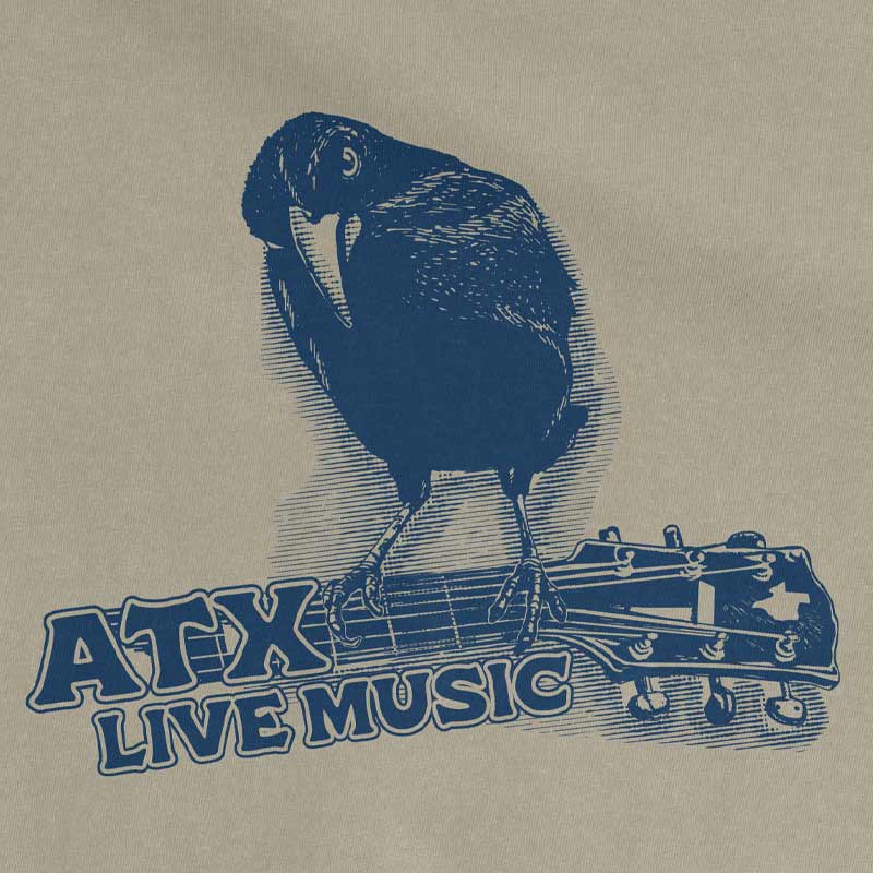 Close-up of guitar-playing crow graphic on ATX Austin Texas Comfort Colors 1717 tee