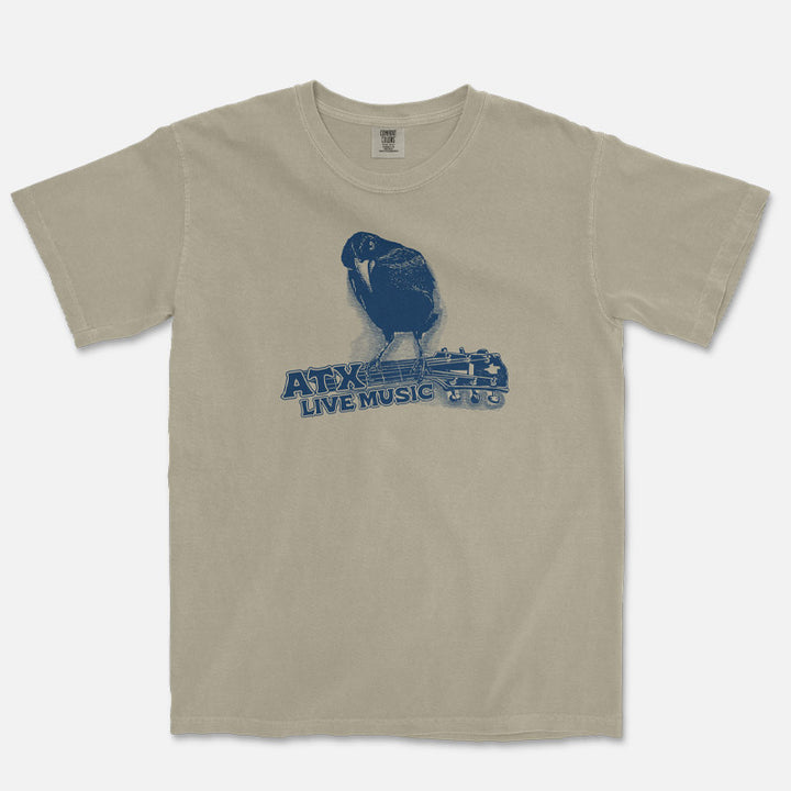 Close-up of guitar-playing crow graphic on ATX Austin Texas Comfort Colors 1717 tee