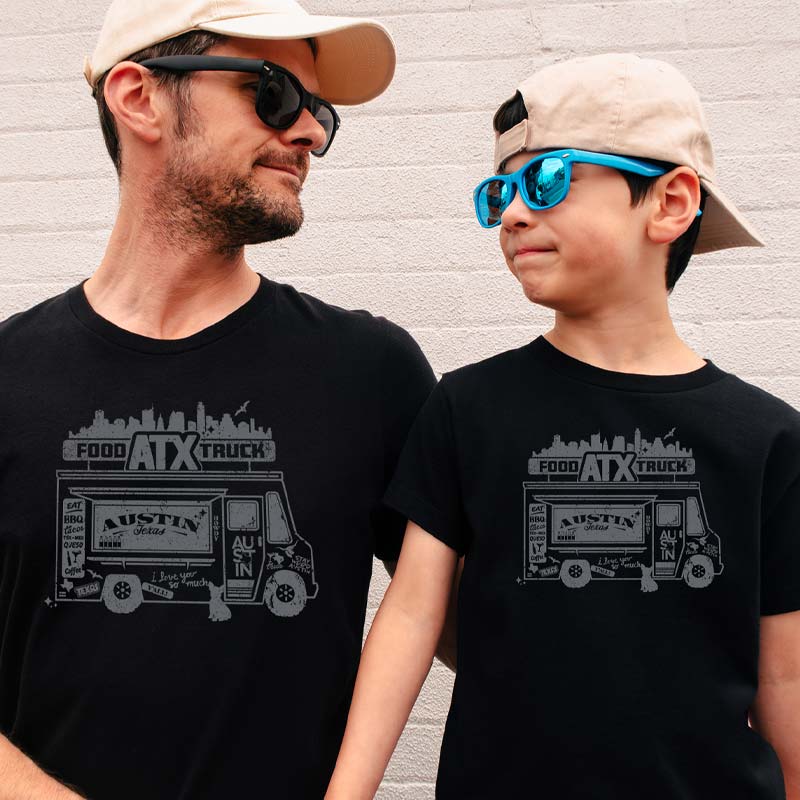 Adult and youth model wearing our ATX Food Truck youth t-shirt with fun food truck graphic – playful Austin street food tee for kids