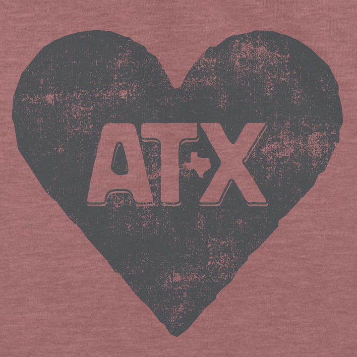 Close up of our ATX Heart youth t-shirt with bold heart graphic – fun and proud Austin-themed tee for kids