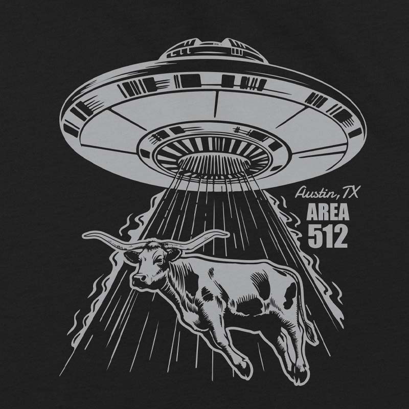 Black t-shirt with a graphic of a UFO abducting a texas longhorn, inspired by Area 512, on a white background.