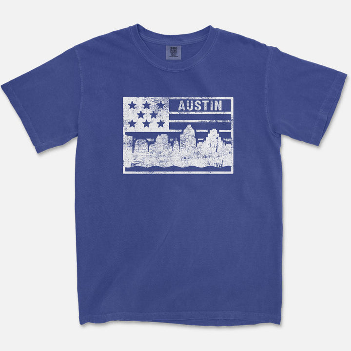China Blue Comfort Colors Austin t-shirt featuring a distressed heritage-style flag graphic with the Austin skyline and vintage Texas-inspired design.