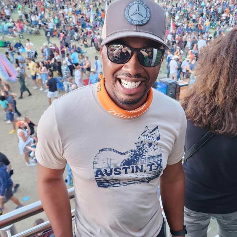 ATX Music Bridge T-shirt, Bats and Music Notes coming out of a guitar shaped bridge in Austin, Texas