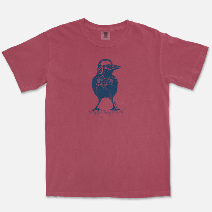 Austin grackle wearing headphones graphic printed on Comfort Colors Brick heavyweight t-shirt