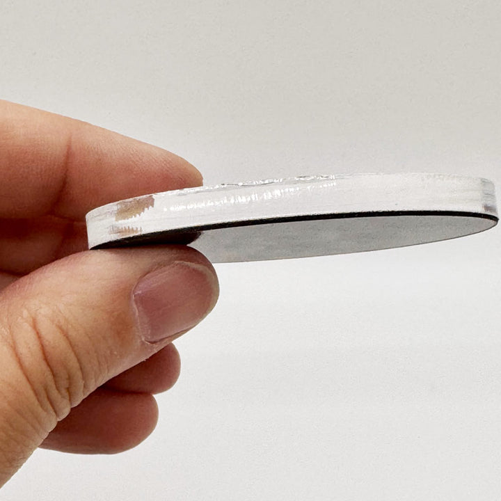 Side angle of Texas Capitol souvenir magnet showing durable acrylic layers