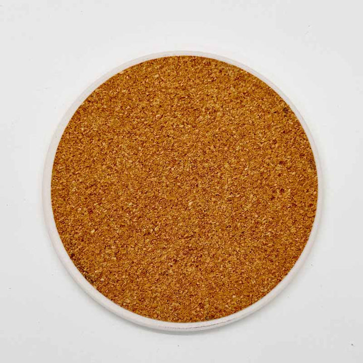 Round cork coaster on a white background