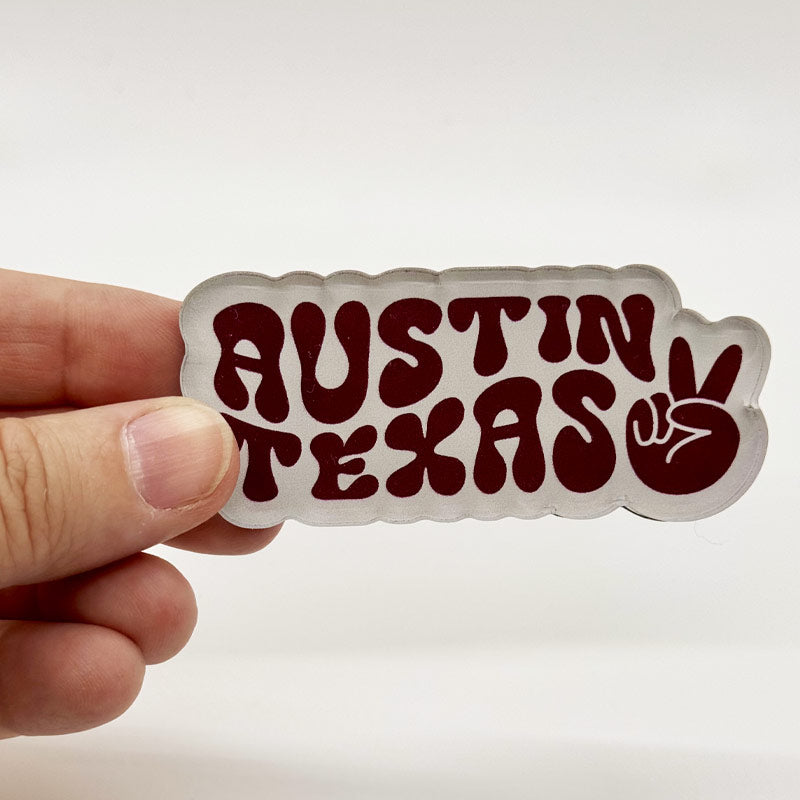 Funky Town acrylic magnet featuring wavy Austin, Texas text and peace sign in bold retro colors