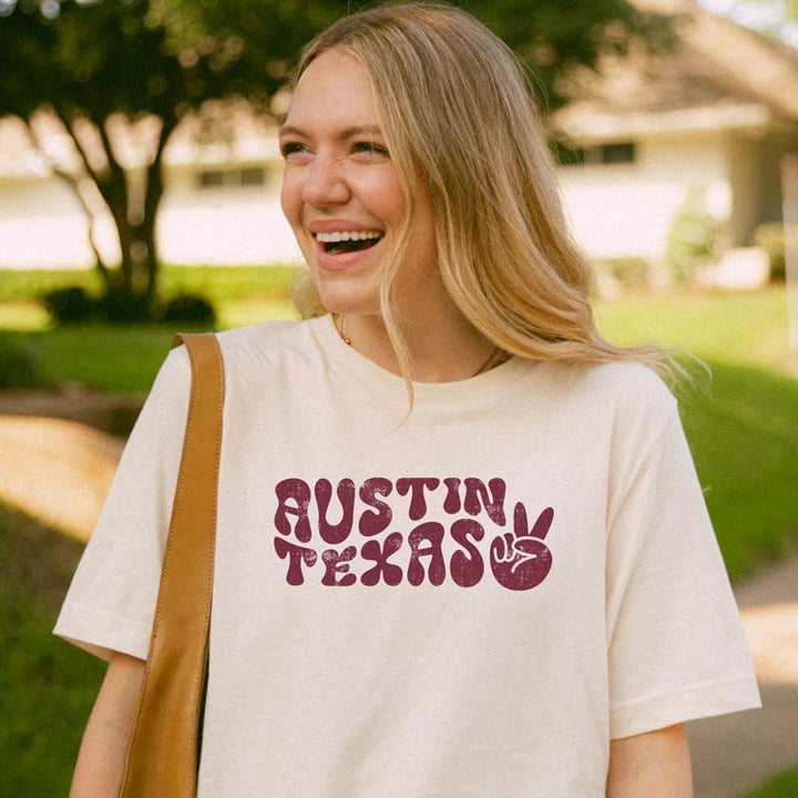 Model wearing Funky Town ATX T-shirt, showcasing vintage-style Austin design