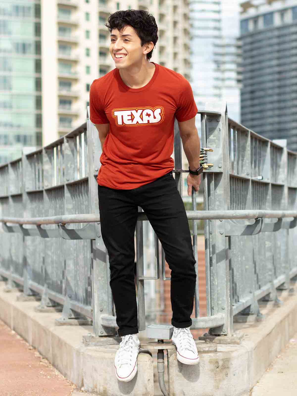 Texas design with lines of Retro colors on a brick colored triblend t-shirt