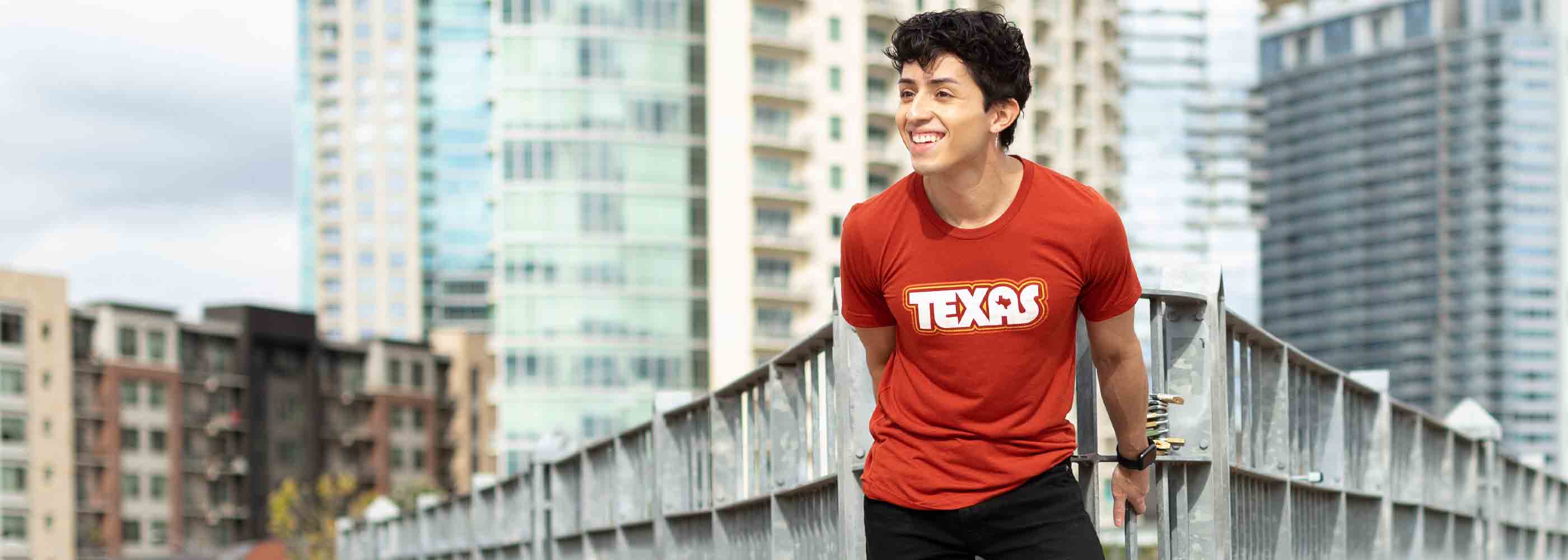 Texas design with lines of Retro colors on a brick colored triblend t-shirt