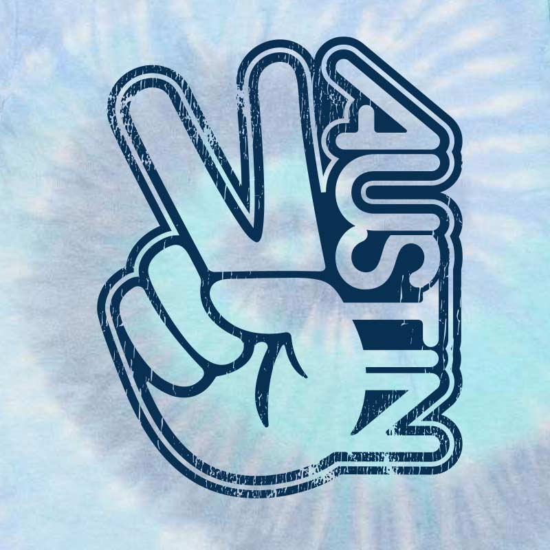Close-up of the "Groovy Austin" retro print on colorful tie-dye cotton, showing fabric texture and graphic detail.