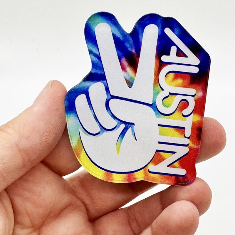 Retro-style Austin magnet with vibrant tie-dye swirls