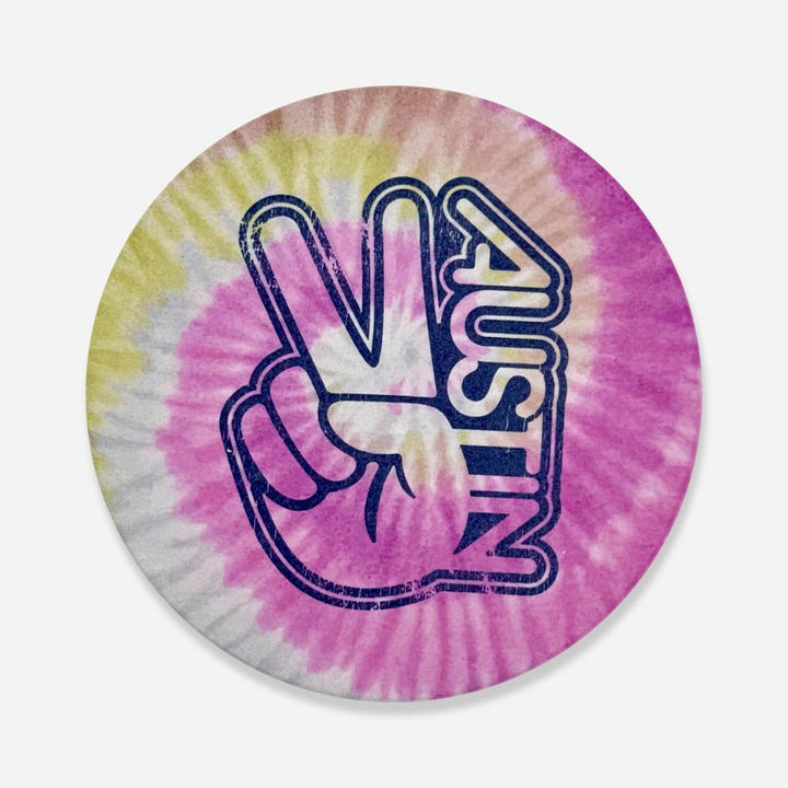 Groovy Austin Desert Rose sandstone coaster with retro tie-dye design in warm desert colors, made from natural stone for vibrant Austin-style drink protection.