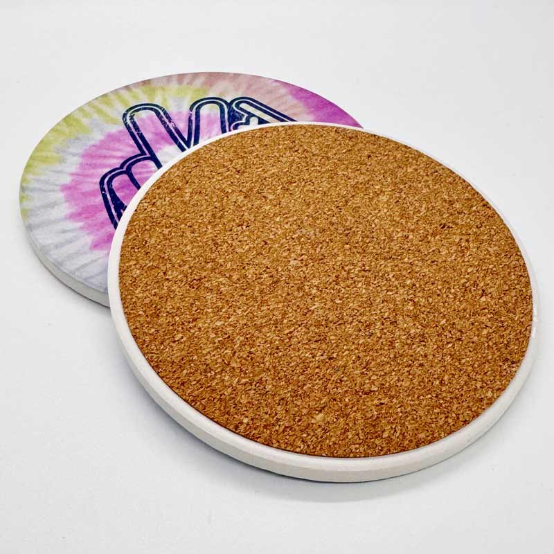 Cork coaster with a white rim on a light gray background