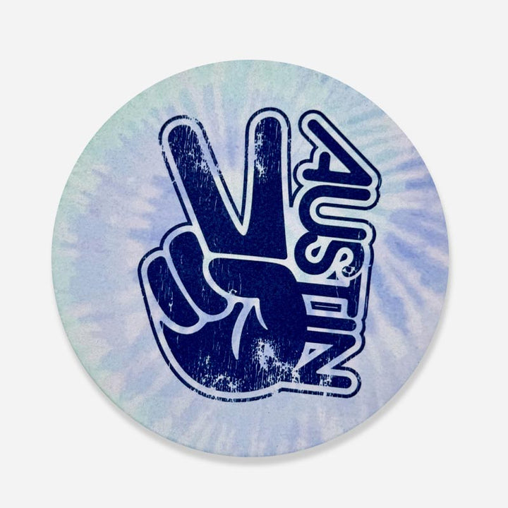 Groovy Austin Lagoon sandstone coaster with bold blue and green tie-dye pattern, inspired by retro Austin vibes and made from natural sandstone for stylish surface protection.