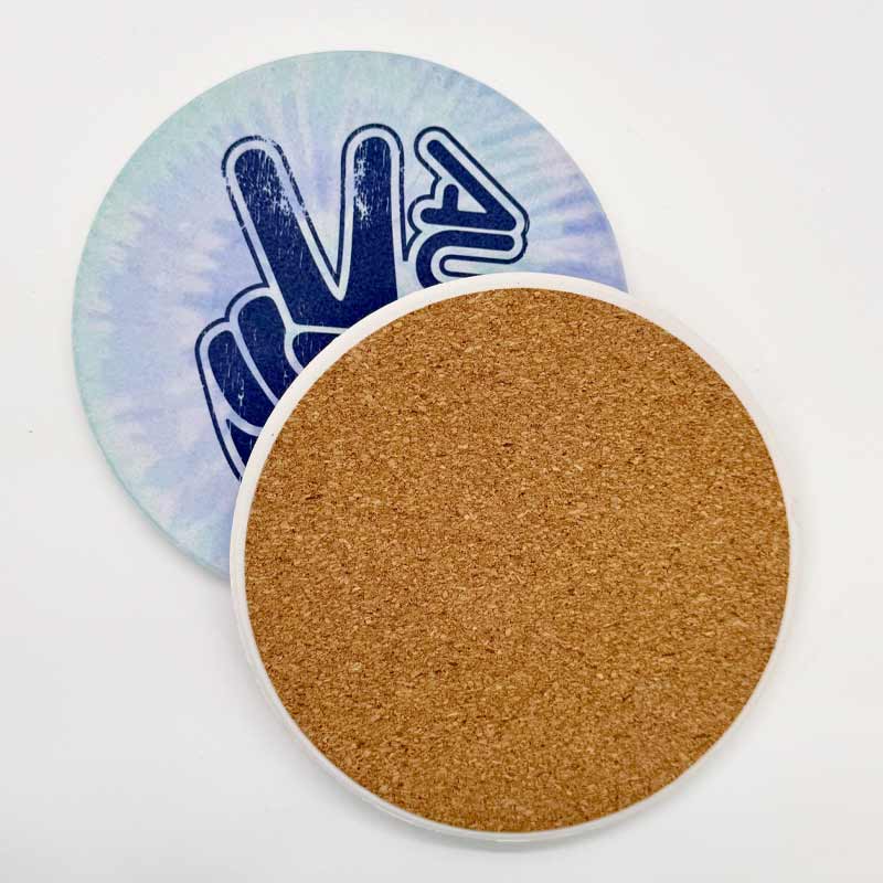 Round cork coaster with a tie-dye design on a white background