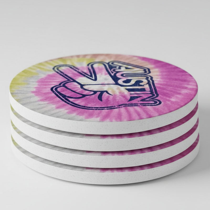 Stack of tie-dye coasters with a logo on a white background