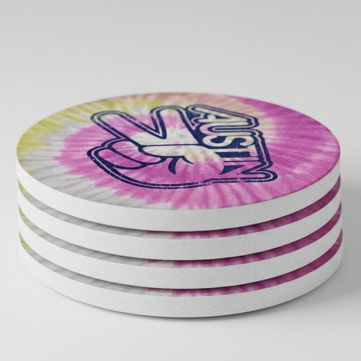 Stack of tie-dye coasters with a logo on a white background