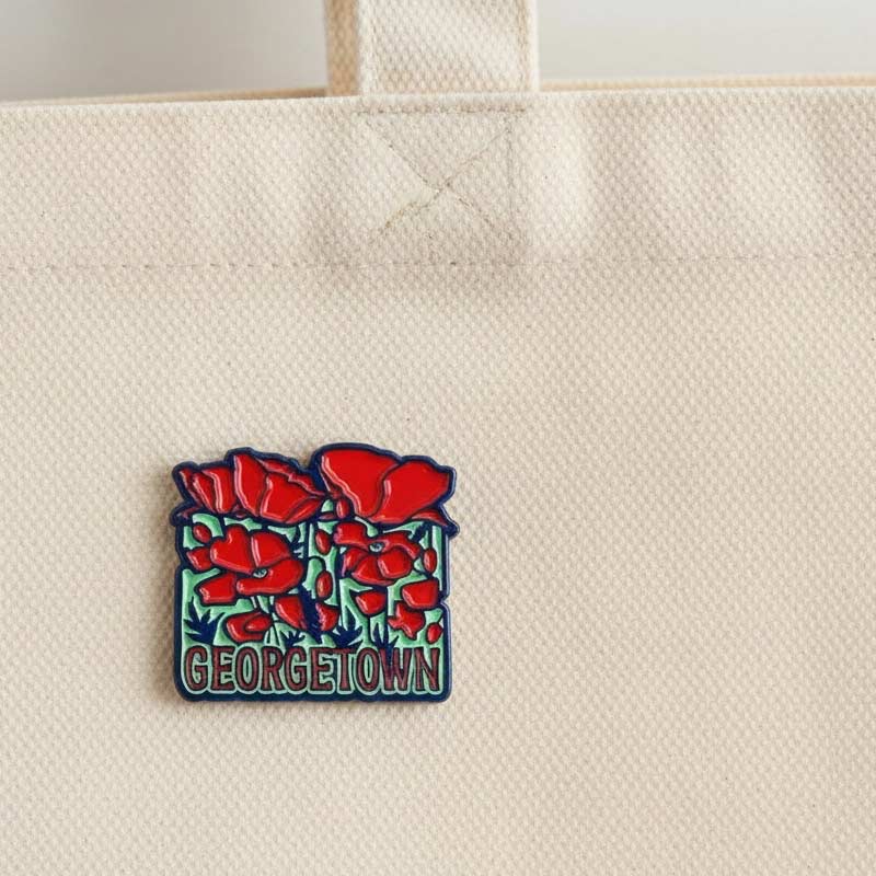 Georgetown patch with red flowers on a beige tote bag