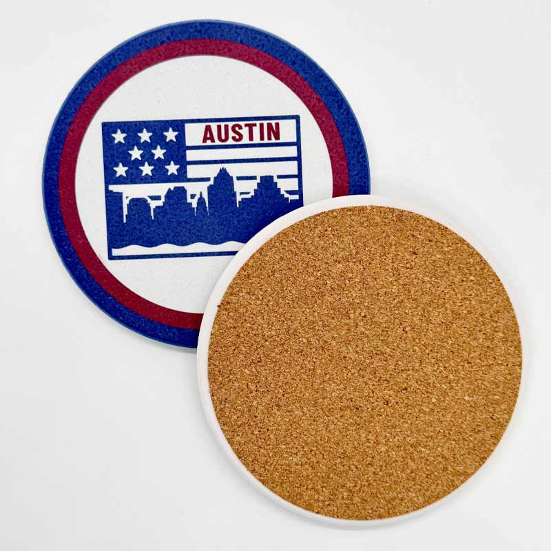 Round coaster with cork back and 'Austin' design on a white background