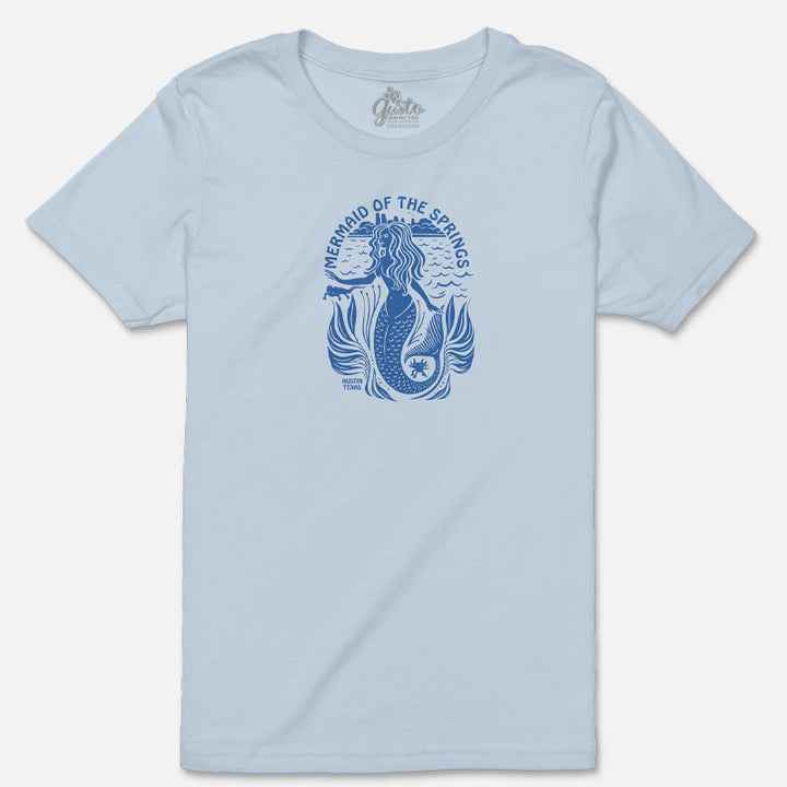 Flat lay of the Mermaid of the Springs Youth Tee showing the whimsical mermaid and Barton Springs salamanders design.
