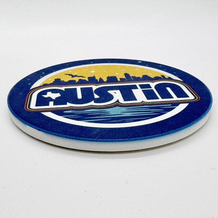 Coaster with 'Austin' design on a white background