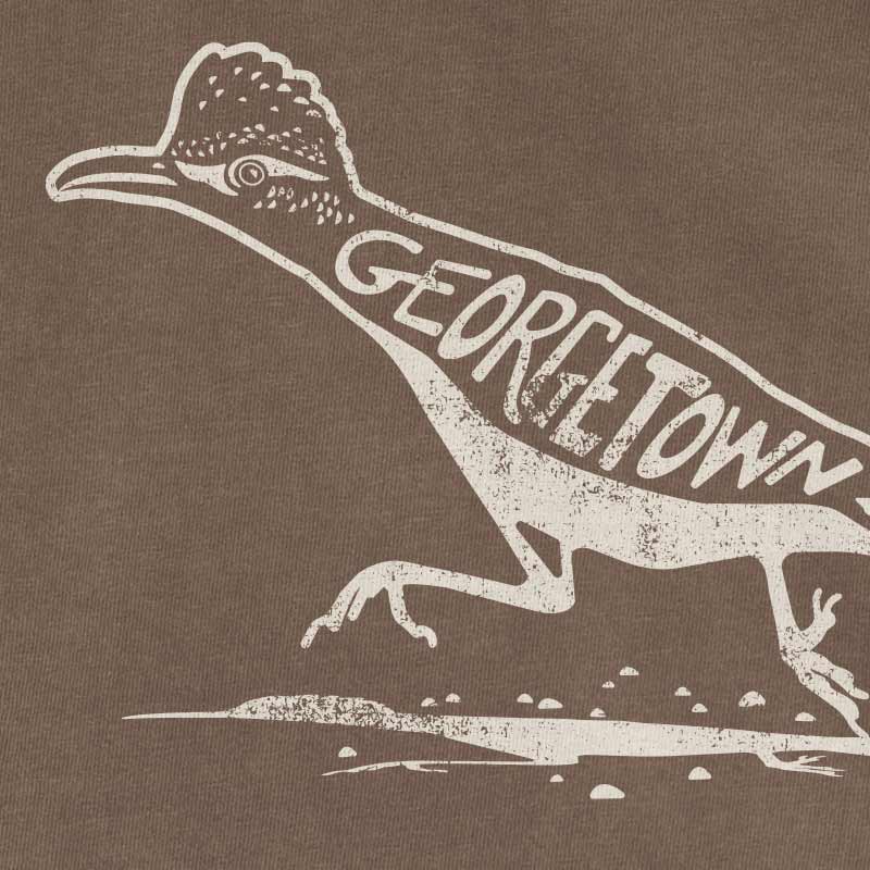 Close-up of Roadrunner design printed in Bora Bora ink on Espresso Comfort Colors shirt, Georgetown TX inspired artwork.