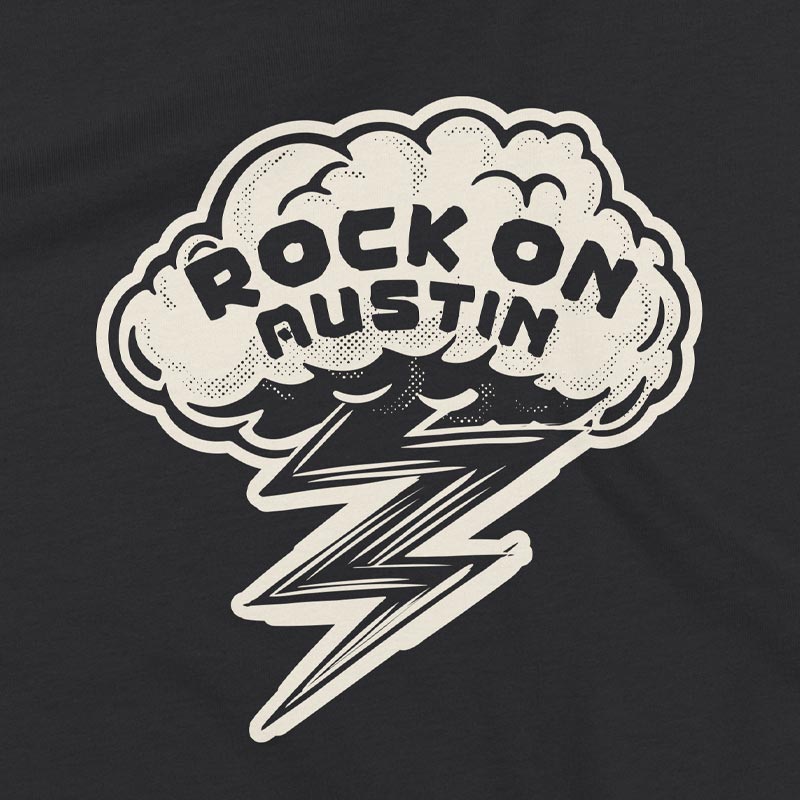 Close up of our Rock On Austin youth t-shirt with bold lightning bolt graphic – fun and energetic music tee for kids