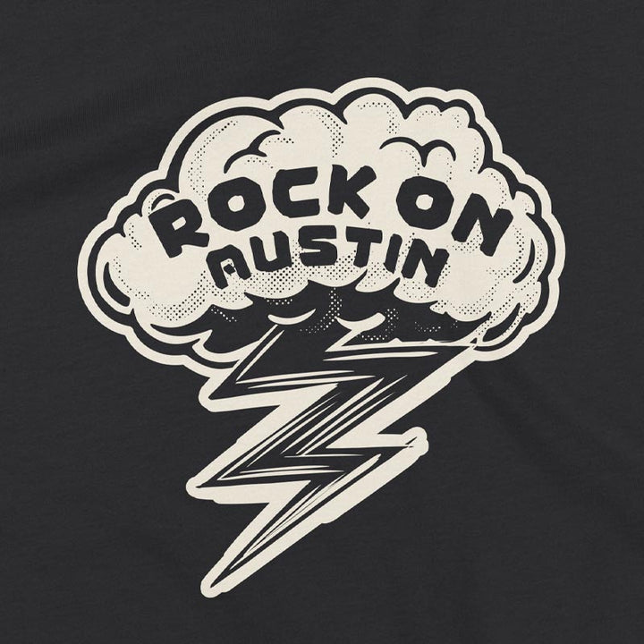 Close up of our Rock On Austin youth t-shirt with bold lightning bolt graphic – fun and energetic music tee for kids