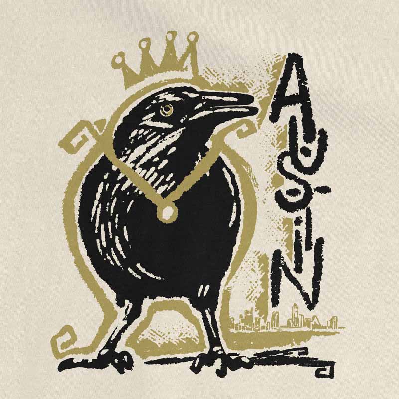 Close-up of crowned grackle graphic on Royal Squawk Austin shirt