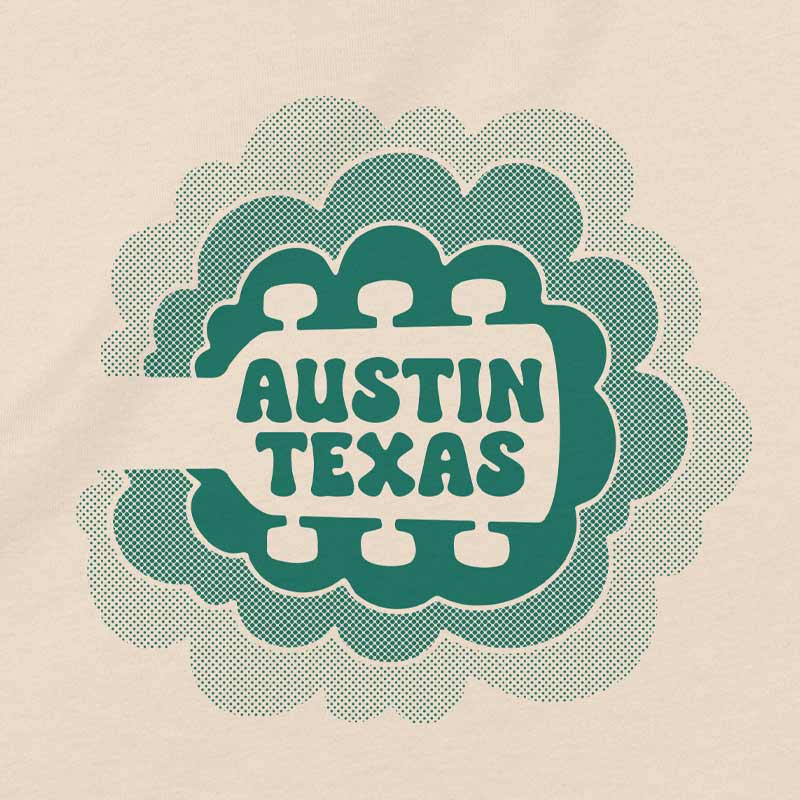 Close up of our Sky Sync youth t-shirt with guitar neck rising into clouds – Austin music-themed tee for kids