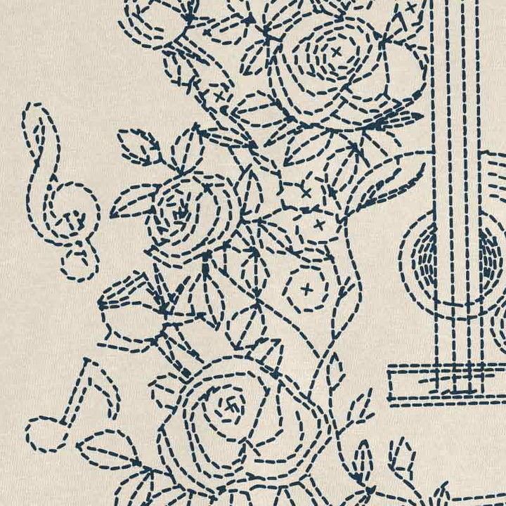Embroidery pattern with floral designs on a beige background